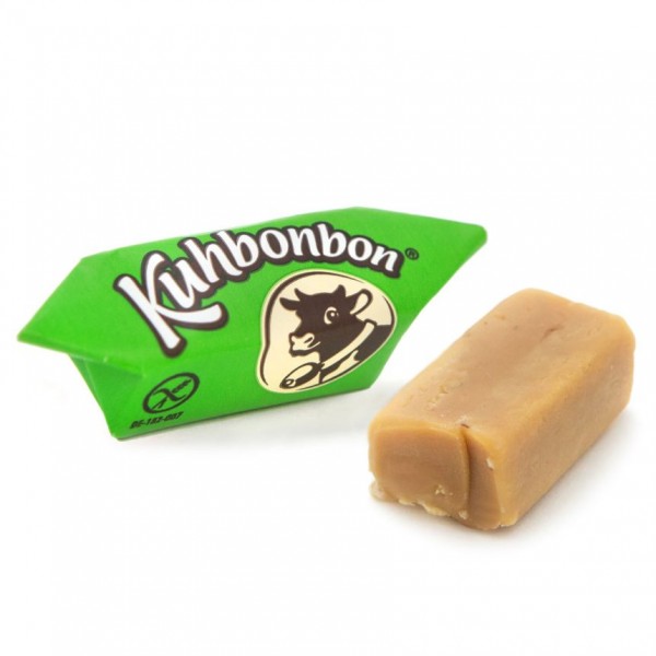Two pieces of soft hazelnut caramels from the German candy manufacturer Kuhbonbon, one individually wrapped